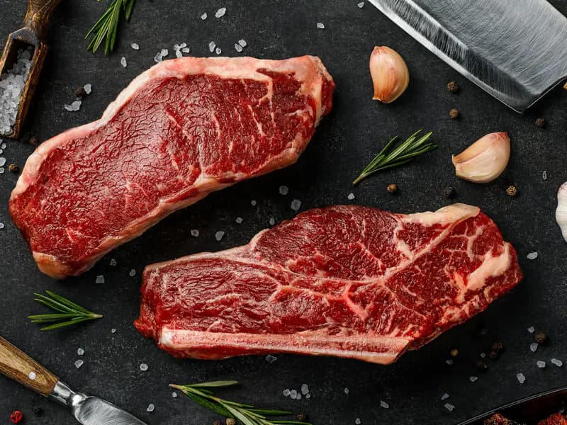 Two raw striploin steaks